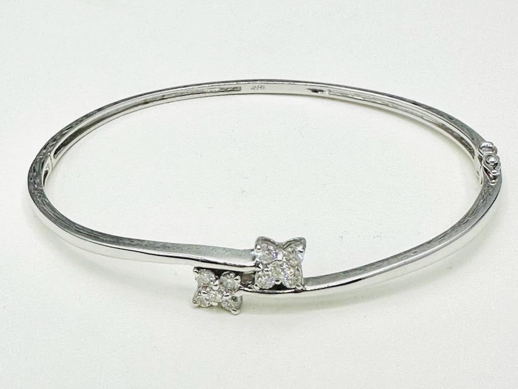 Natural Diamond Bangle Bracelet in 14KT White Gold # 2197: # 2197 Natural Diamond Bangle Bracelet in 14KT White Gold 10 Pieces Diamond 0.55 carat(t.w.) Weight: 9.80 grams Approx. Length: 7.5”