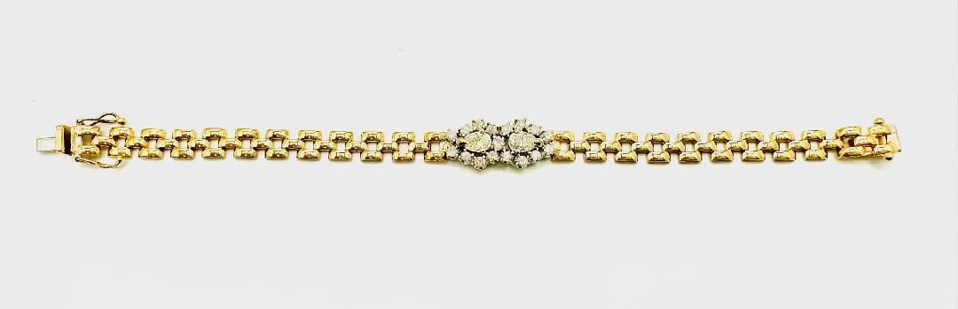 Natural Diamond Bracelet in 14KT Yellow and White Gold # 2202: # 2202 Natural Diamond Bracelet in 14KT Yellow and White Gold 19 Pieces Pear Shaped and Round Diamond 1.55 carats(t.w.) Box clasp with safety locks closure Weight: 12.30 grams Size: 6.5”