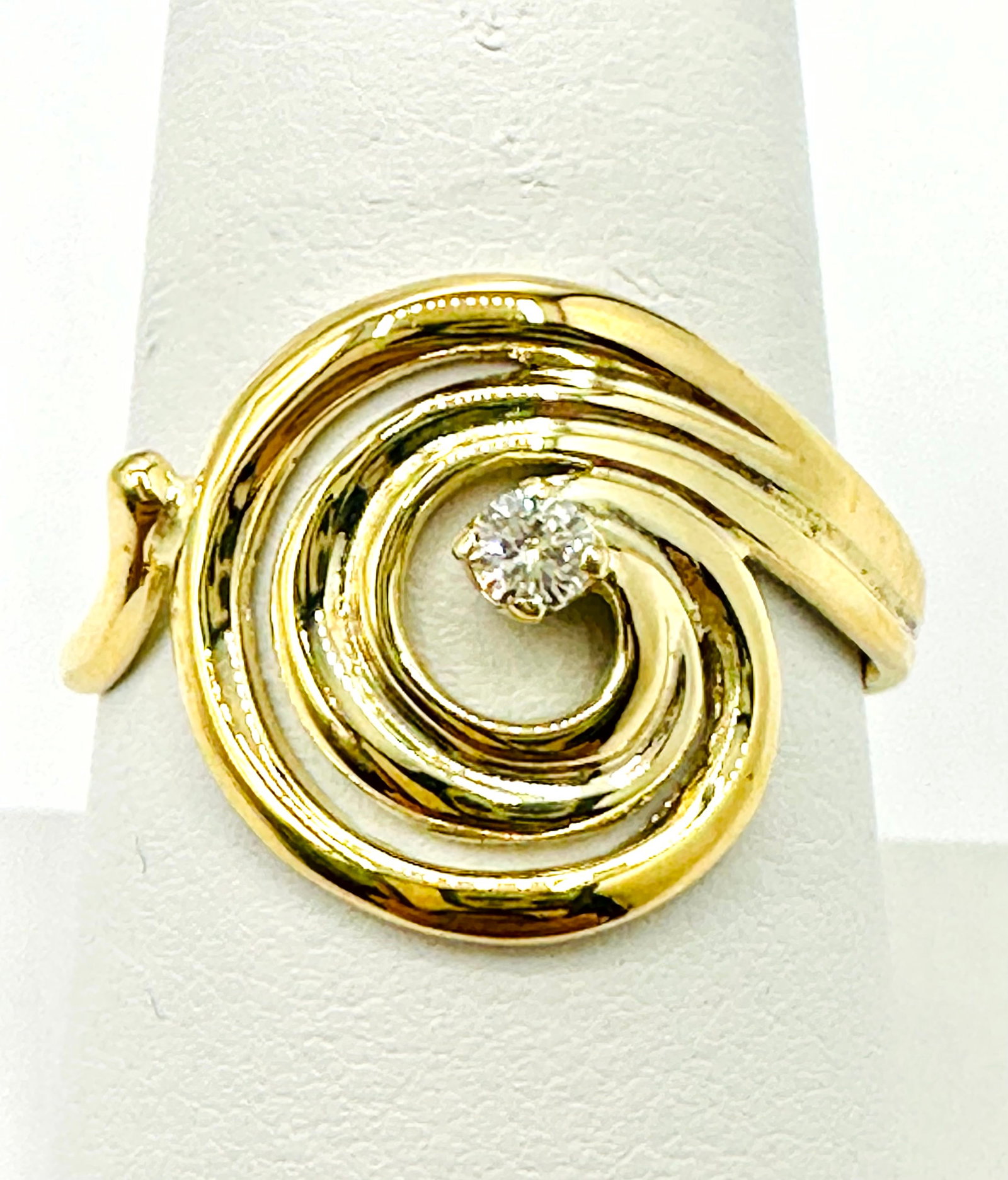 Natural Diamond Swirl Ring, 14KT Yellow Gold # 2240: # 2240 Natural Diamond Swirl Ring, 14KT Yellow Gold 1 piece diamond 0.08 carat Ring Weight: 3.50 Grams Ring Size 8.5