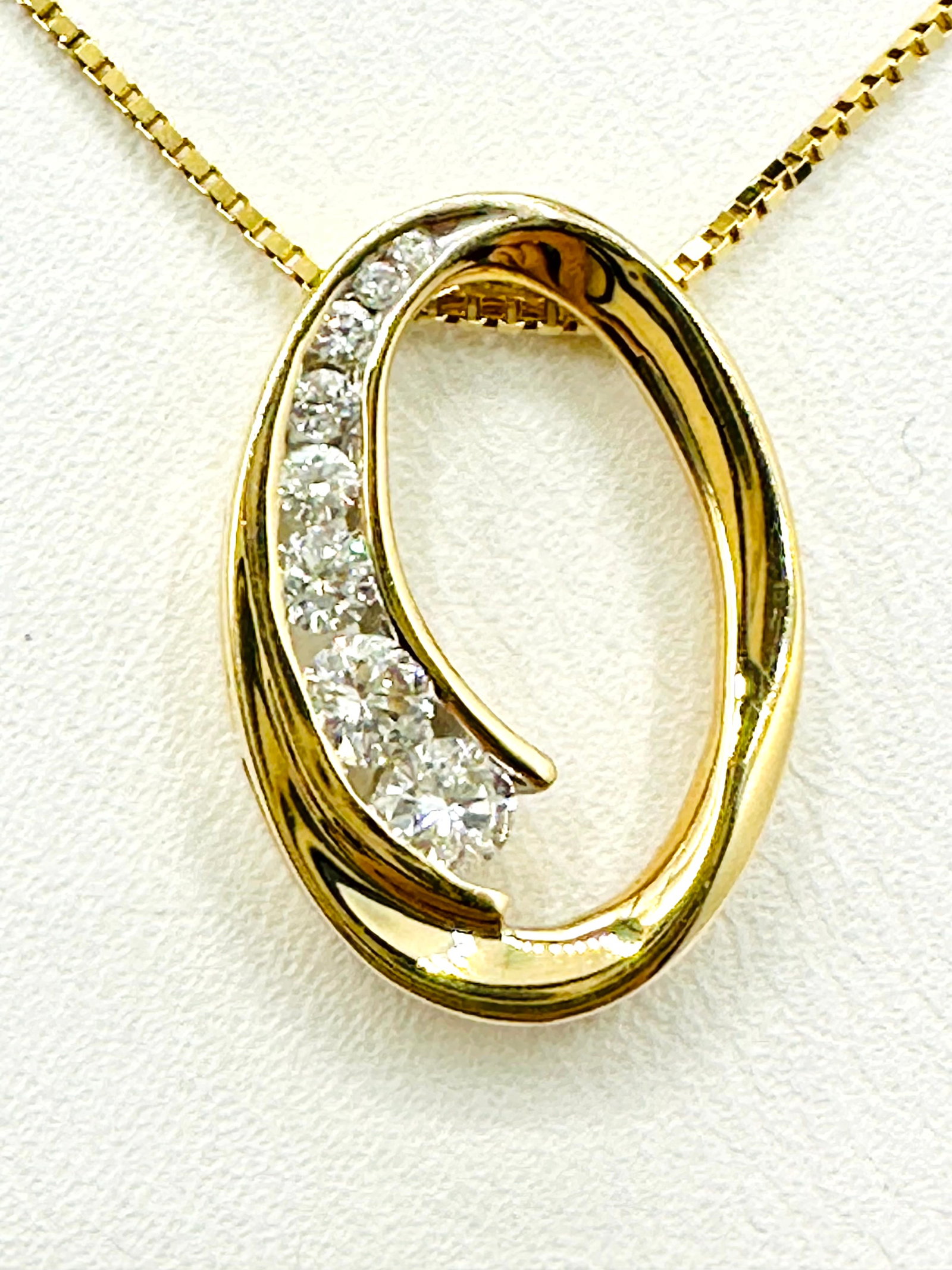 Natural Diamond, 14KT Yellow Gold Oval Pendant and Chain # 2252: # 2252 Natural Diamond, 14KT Yellow Gold Oval Pendant and Chain 8 pieces diamond 0.27 carat( t. w.) 16” box chain with spring ring clasp closure Pendant and Chain Weight: 2.90 grams Pendant size