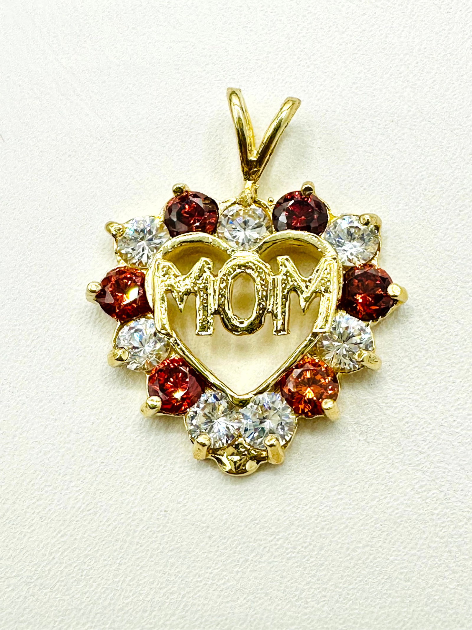 14KT Yellow Gold Color Stone MOM Heart Pendant #2261: #2261 14KT Yellow Gold Color Stone MOM Heart Pendant 13 pieces of stone Pendant Weight: 3.3 grams Pendant size: 24.5 mm x 20.50 mm