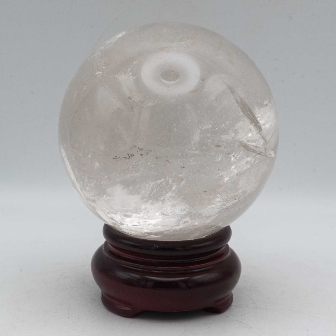 Natural Clear Quartz Crystal Sphere: Medium: Clear Quartz Size: 3.3x3.3x4.5 inches Age/Detail: Natural Condition: great overall, check photo for condition reference. Natural clear quartz crystal sphere with internal veils and inclusions,
