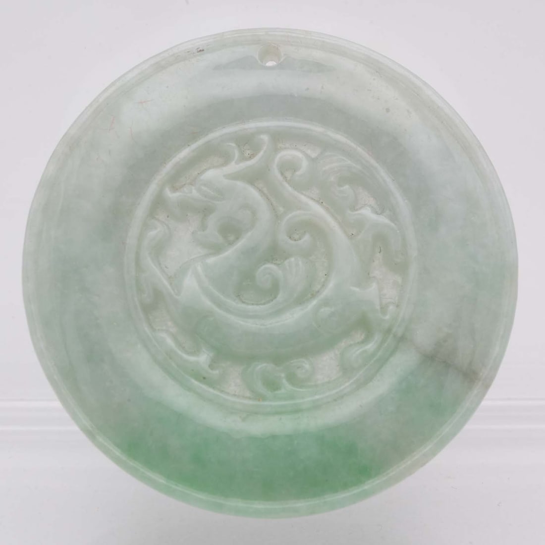 Chinese Carved Natural Green Jadeite Dragon Round Pendant: Medium: Natural Green Jadeite Size: 2x2x0.3 inches Age/Detail: Chinese Carved Condition: great overall, check photo for condition reference. Provenance: Collection from Estate in Tribecca