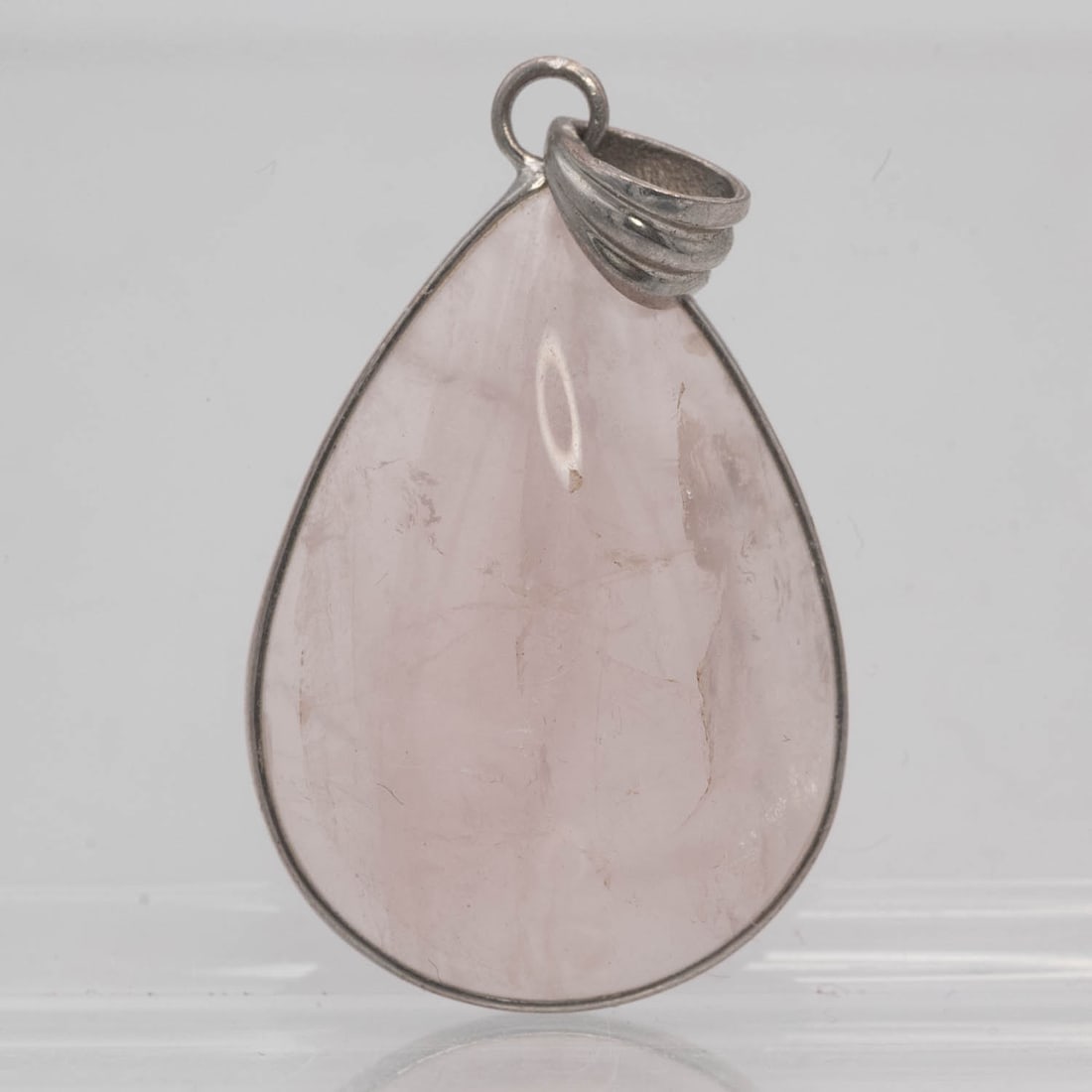 Sterling Silver Bezel Natural Rose Quartz Teardrop Pendant: Medium: Natural Rose Quartz Size: 1.2x0.8x0.3 inches Age/Detail: Sterling Silver Bezel Condition: great overall, check photo for condition reference. Provenance: Collection from Estate in Williamsburg