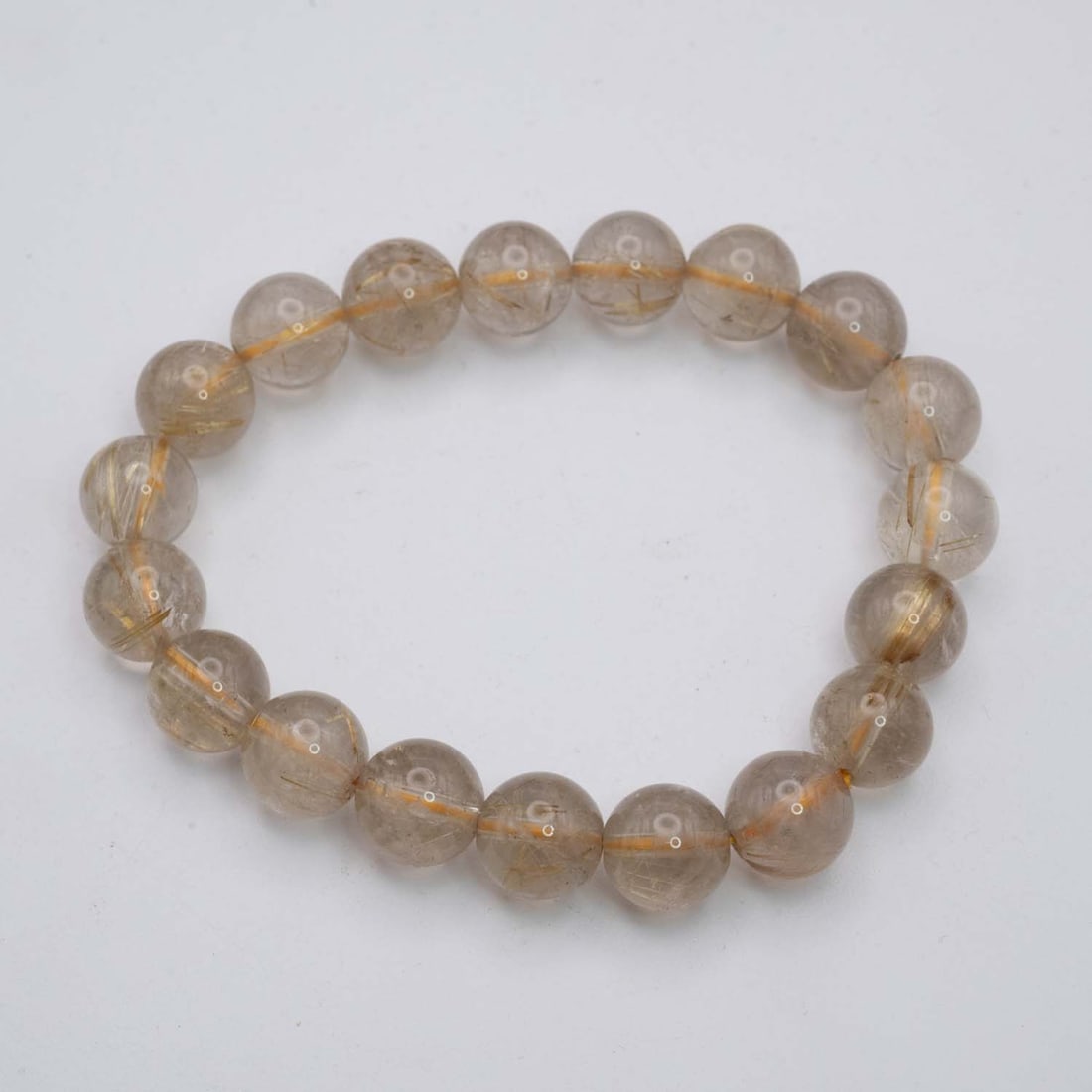 Natural Golden Rutilated Quartz Bracelet: Medium: Golden Rutilated Quartz Size: 11mm diameter each bead Age/Detail: Natural Condition: great overall, check photo for condition reference. Provenance: Collection from Estate in Williamsburg Live