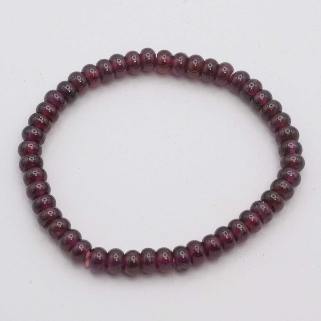 Natural Garnet Bead Bracelet: Medium: Garnet Size: 5x2mm per bead Age/Detail: Natural Condition: great overall, check photo for condition reference. Provenance: Collection from Estate in Williamsburg LiveShipping is NOT a part of 