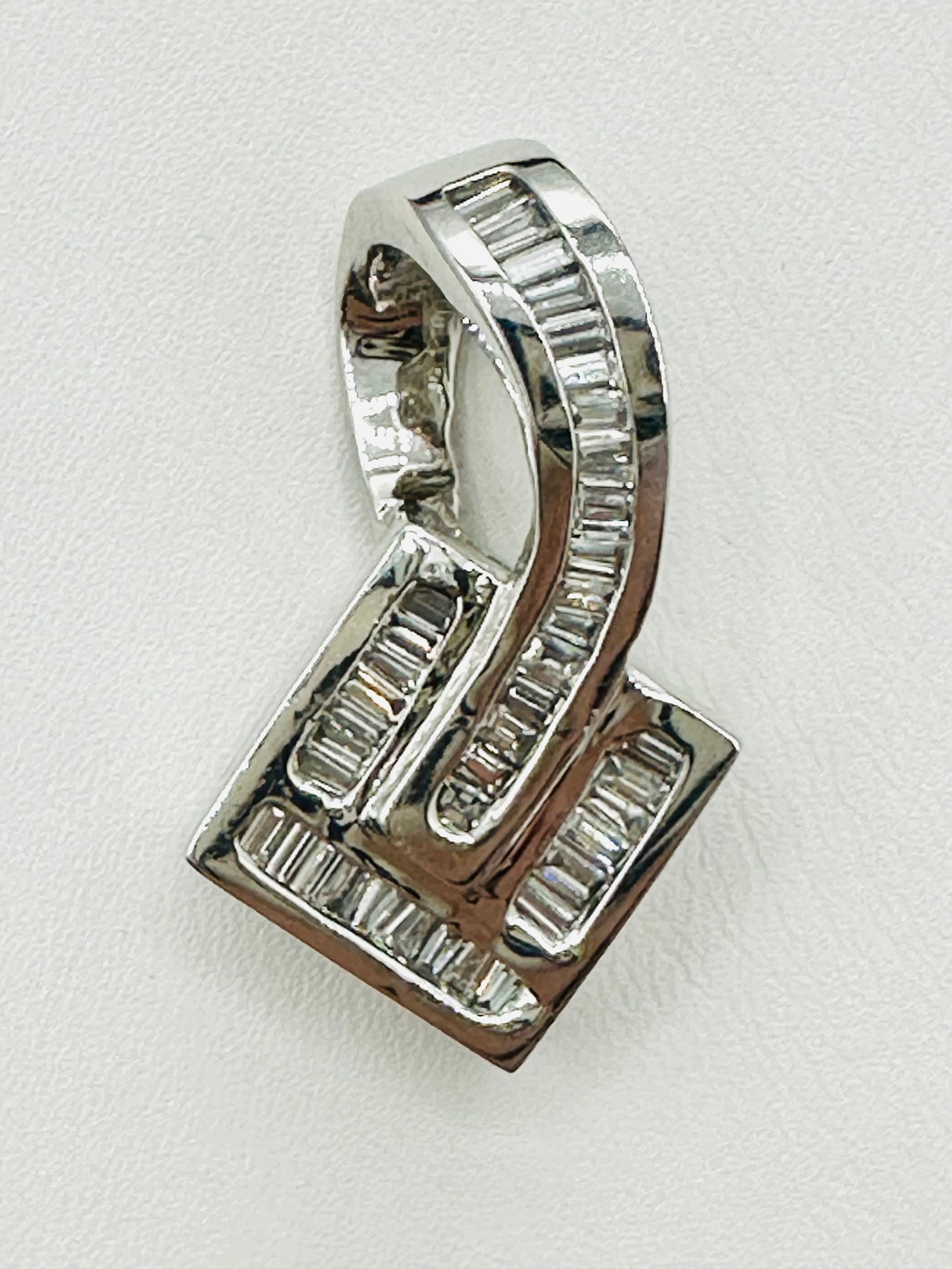 Natural Diamond 14KT White Gold Pendant # 2330: # 2330 Natural Diamond 14KT White Gold Pendant Baguette Diamond 1.15 carats (t.w.) Pendant Weight: 9.90 grams Pendant Size: 31 mm X 19 mm
