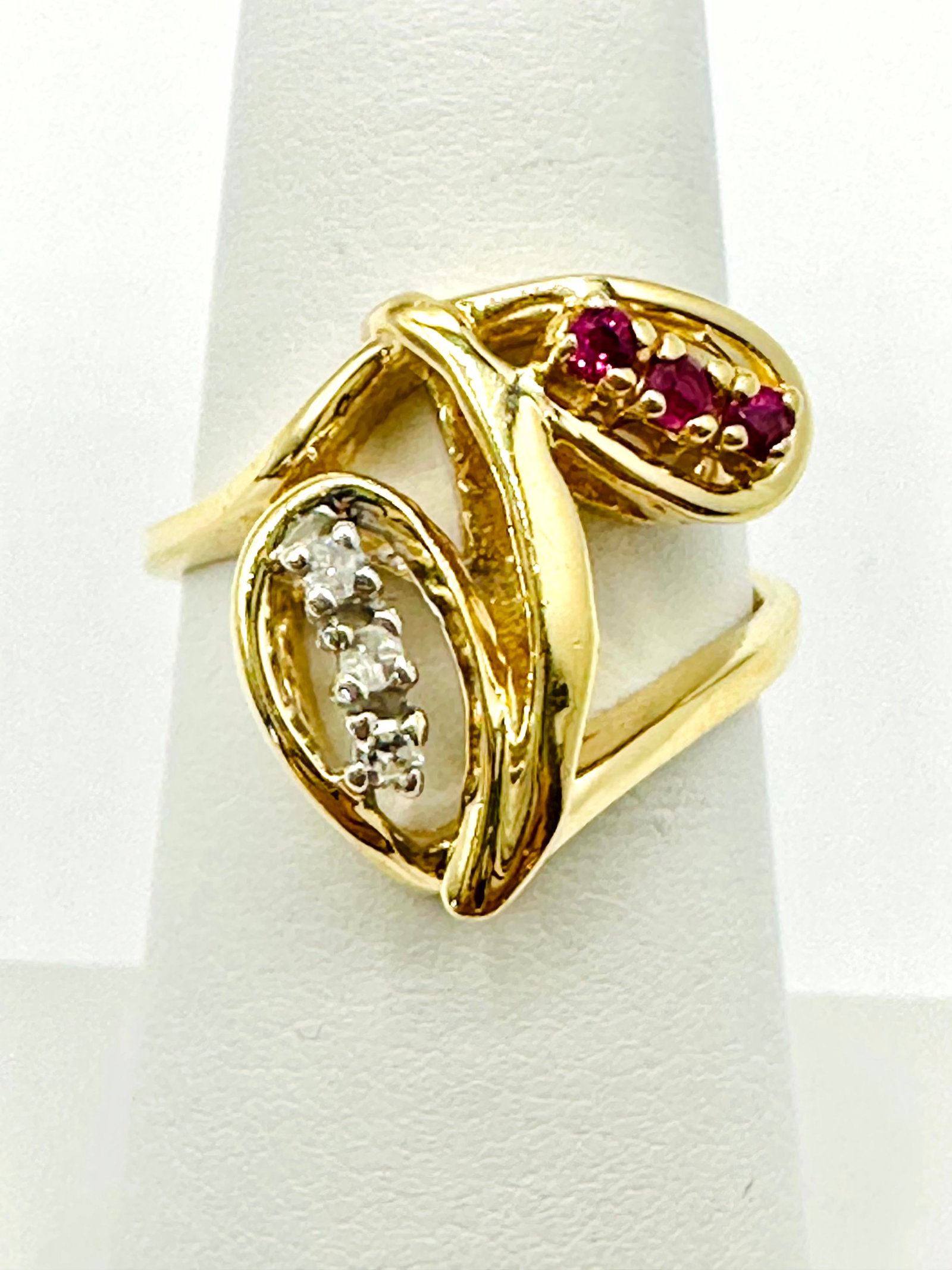 Natural Ruby and Diamond Ring in 14KT Yellow and White Gold # 2214: # 2214 Natural Ruby and Diamond Ring in 14KT Yellow and White Gold 3 Pieces Diamond 0.08 carat(t.w.) 3 Pieces ruby 0.10 carat(t.w.) Ring Weight: 4.50 grams Size: 6.25