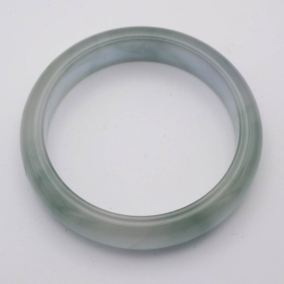 Chinese Icy Green Jade Bangle: Medium: Icy Green Jade Size: 2.5 inches Age/Detail: Chinese Condition: great overall, check photo for condition reference. Provenance: Collection from Estate in Williamsburg LiveShipping is NOT a part