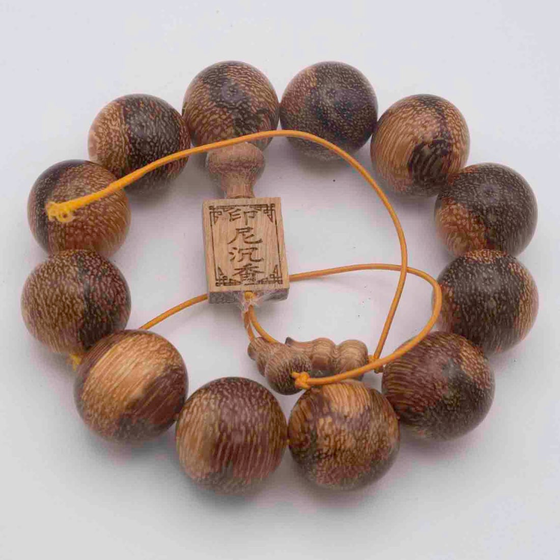 Indonesian Agarwood Bead Bracelet: Medium: Agarwood Size: 0.7x0.8 inches Age/Detail: Indonesian Condition: great overall, check photo for condition reference. Provenance: Collection from Estate in Williamsburg LiveShipping is NOT a par
