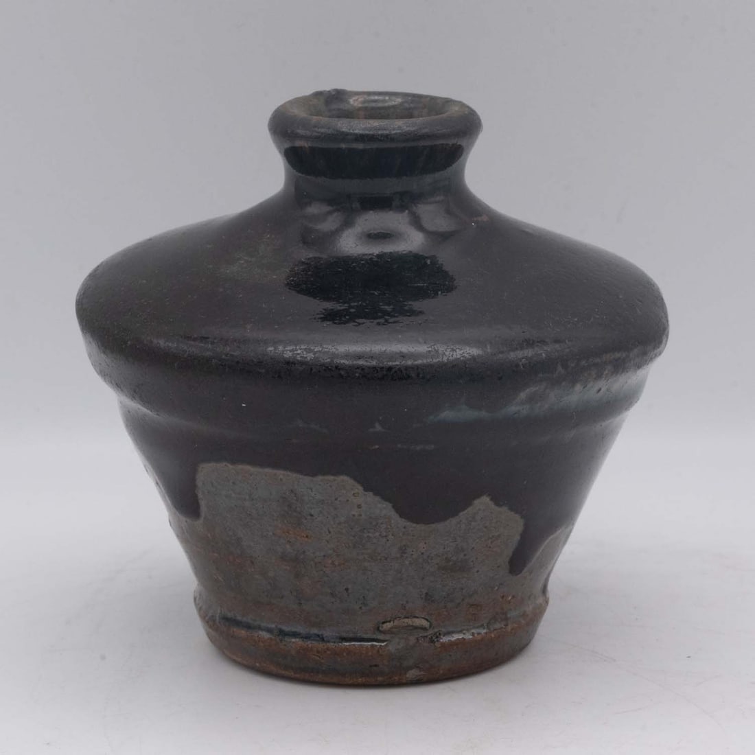 Antique Chinese Black Glaze Pottery Jar: Medium: Black Glaze Pottery Size: 4x4x4 inches Age/Detail: Antique Chinese Condition: great overall, check photo for condition reference. A small Chinese-style stoneware jar of compressed baluster for