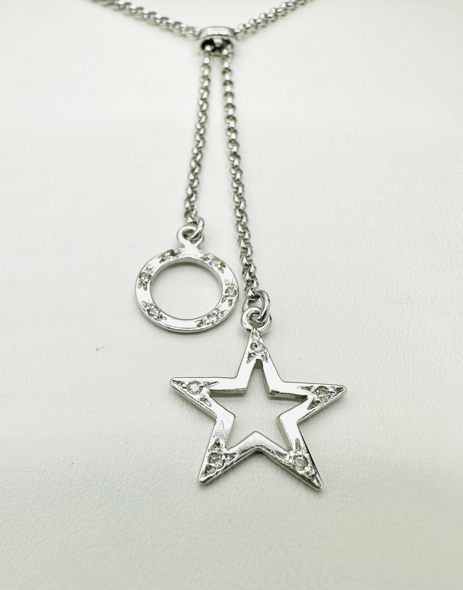 Natural Diamond Charms 14KT White Gold Necklace # 2624: # 2624 Natural Diamond Charms 14KT White Gold Necklace 11 pieces diamond 0.06carat(t.w.) 17â€? chain with lobster lock closure Necklace Weight: 4.70 grams (t.w.) Pendant approx. drop 2â€?