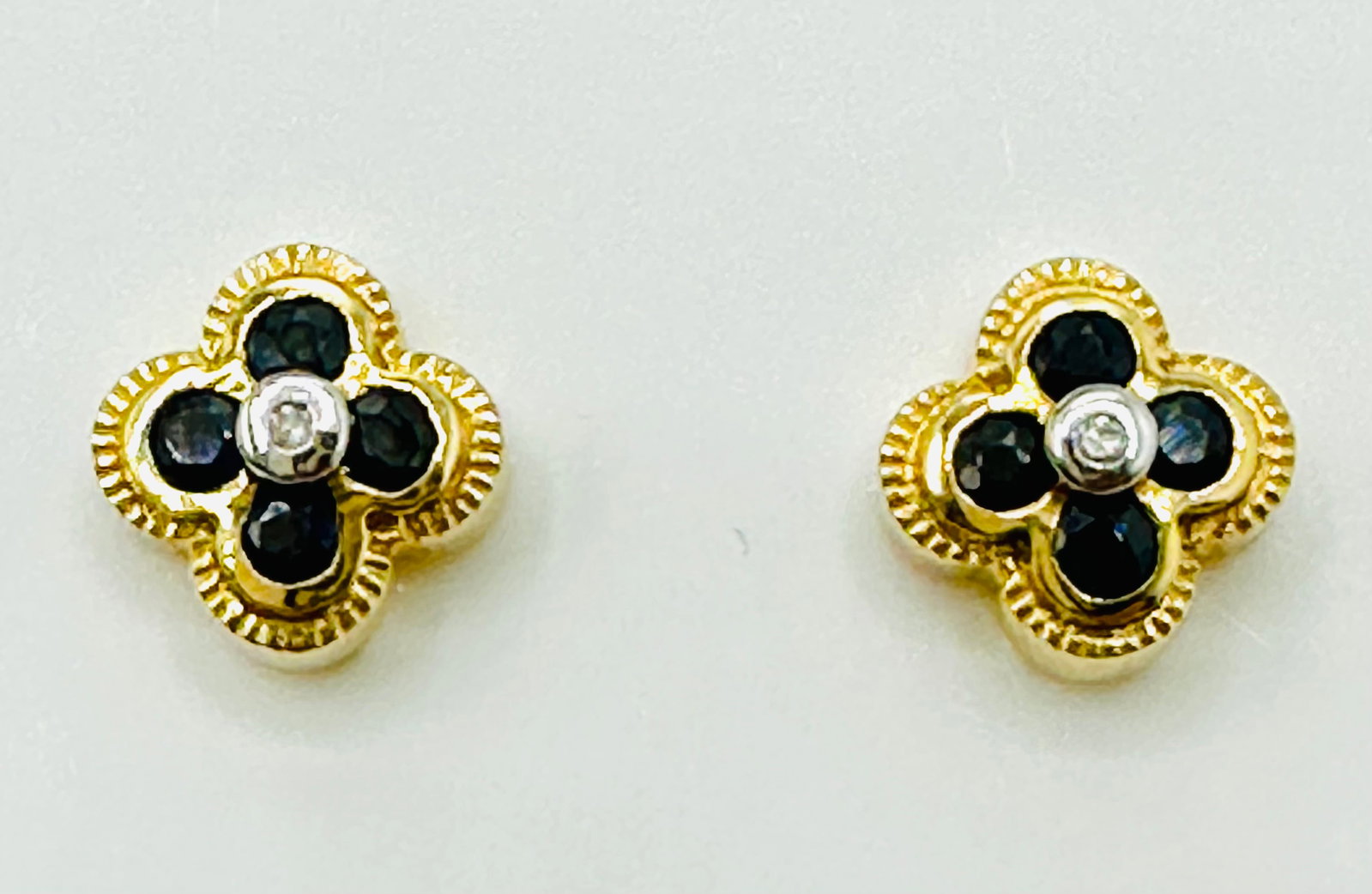 Pair of Natural Sapphire and Diamond Earrings, 14KT Yellow Gold # 2676: # 2676 Pair of Natural Sapphire and Diamond Earrings, 14KT Yellow Gold 2 pieces diamond 8 pieces ruby 0.40 carat( t.w.) Weight: 1.80 grams(t.w.) Size: 7 mm X 7 mm