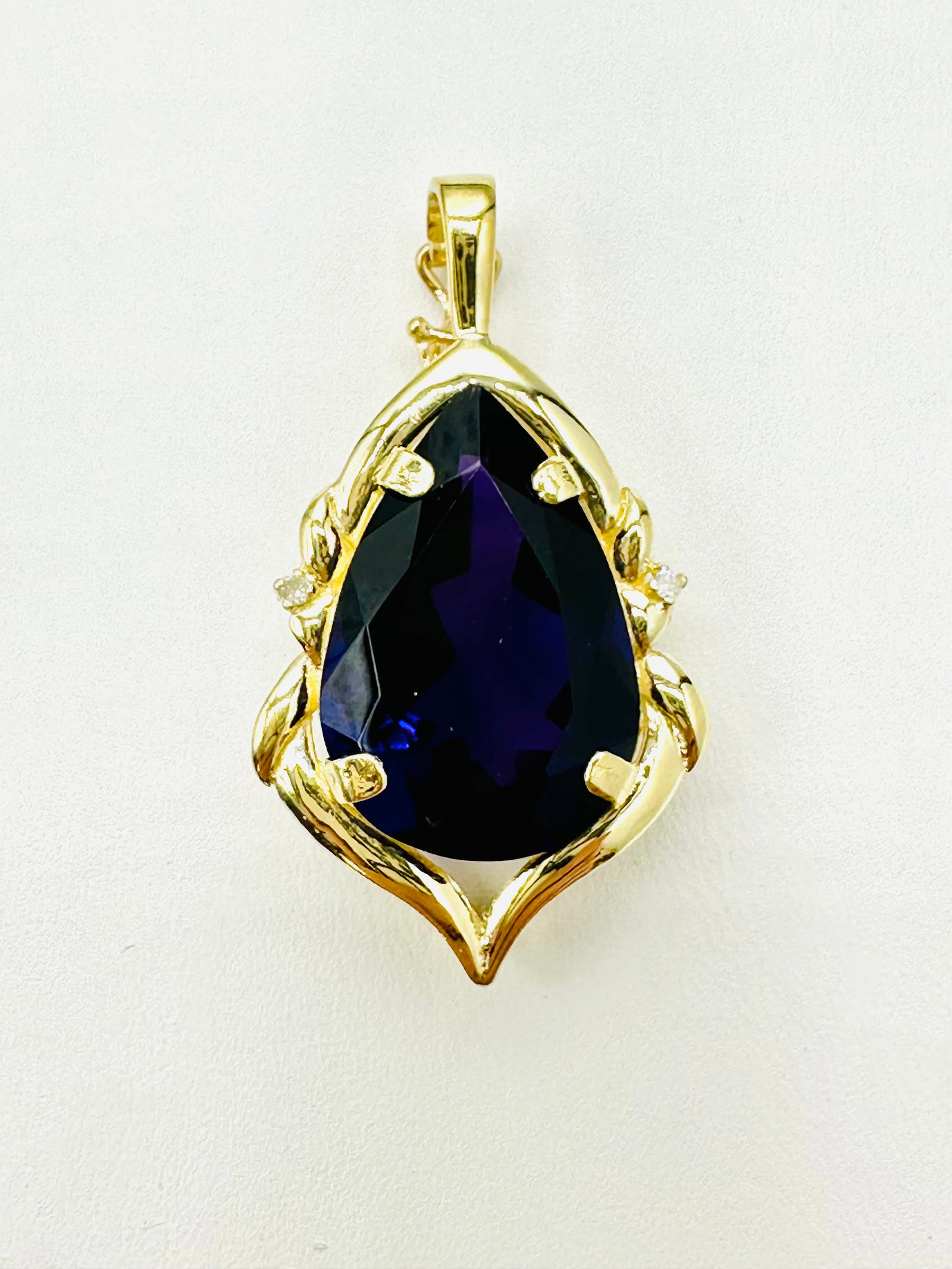 14KT Yellow Gold, Amethyst and Diamond Pendant # 2710: # 2710 14KT Yellow Gold, Amethyst and Diamond Pendant 2 pieces diamond 0.03 carat(t.w.) 1 piece pear shaped amethyst Pendant Weight: 6.00 grams (t.w.) Pendant size: 37 mm X 20 mm