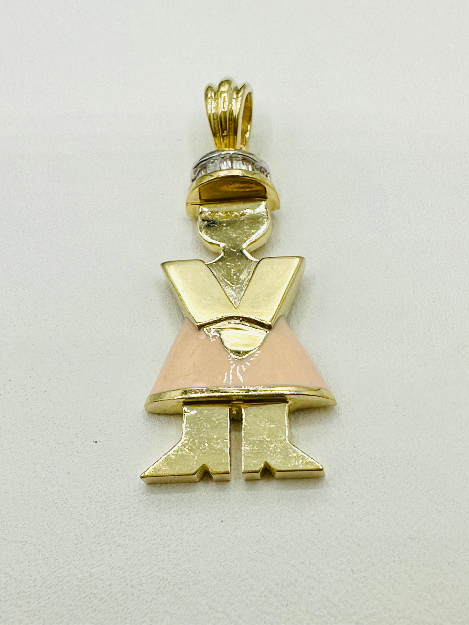 14KT Yellow Gold Natural Diamond Girl Pendant with enamel. # 2779: # 2779 14KT Yellow Gold Natural Diamond Girl Pendant with enamel. Baguettes diamond 0.10 carat (t.w.) Pendant Weight: 4.60 grams (t.w.) Pendant size: 33 mm X 13.5 mm