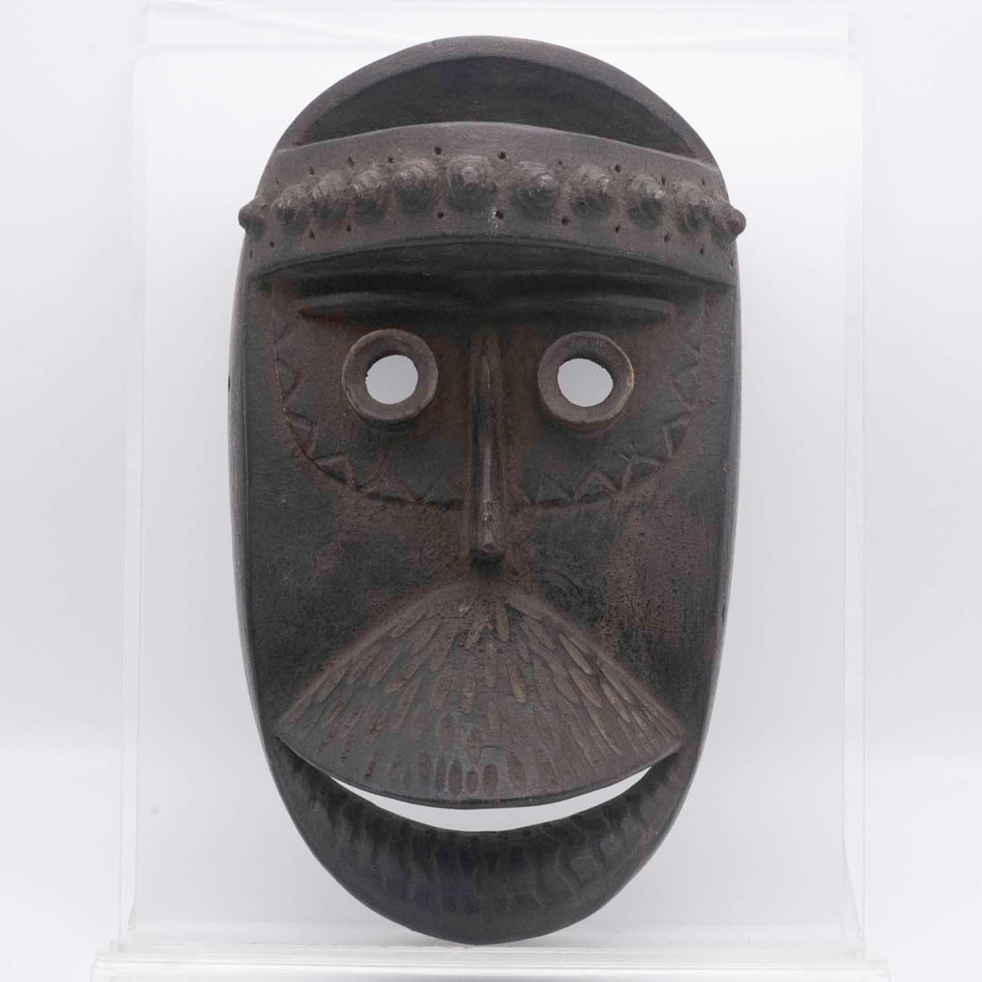 African Grebo Carved Wood Mask with Tubular Eyes and Beard: Medium: Carved Wood Size: 5.8x9.3x3.5 inches Age/Detail: African Grebo Condition: great overall, check photo for condition reference. Provenance: Collection from Estate in Williamsburg LiveShipping is