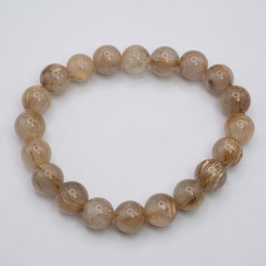 Natural Golden Rutilated Quartz Bracelet: Medium: Golden Rutilated Quartz Size: 11mm diameter each bead Age/Detail: Natural Condition: great overall, check photo for condition reference. Provenance: Collection from Estate in Williamsburg Live