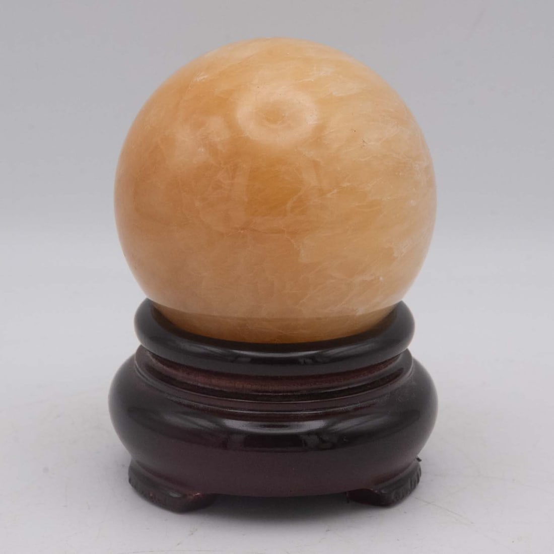 Polished Natural Orange Calcite Sphere With Stand: Medium: Orange Calcite Size: 2.3x2.3x3 inches Age/Detail: Polished Natural Condition: great overall, check photo for condition reference. Provenance: Collection from Estate in Williamsburg LiveShippin
