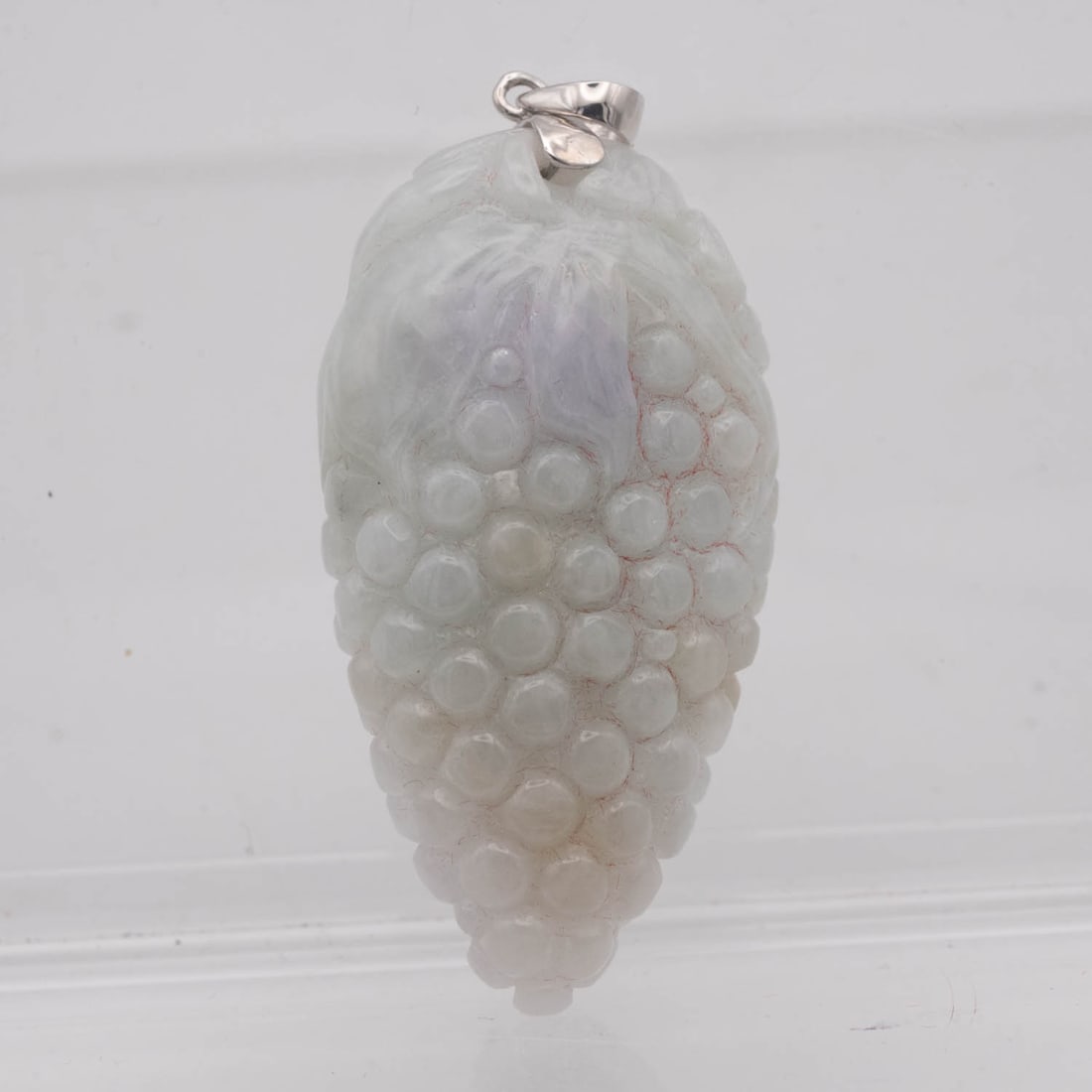 Chinese Carved Jadeite Grapes Pendant: Medium: Jadeite Size: 1.8x1x0.5 inches inner diameter Age/Detail: Chinese Carved Condition: great overall, check photo for condition reference. Provenance: Collection from Estate in Tribecca LiveShipp