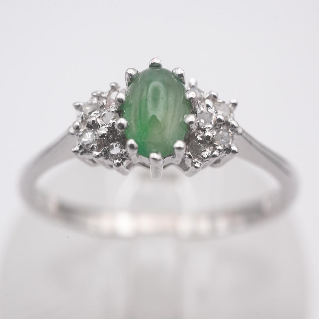 14K White Gold Natural Glassy Green Jadeite Ring: Medium: Natural Glassy Green Jadeite Size: US7.5, 2.3 gram Age/Detail: 14K White Gold Condition: great overall, check photo for condition reference. Provenance: Collection from Estate in Tribecca Live
