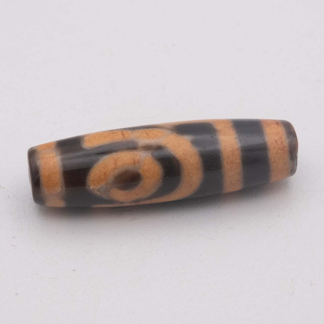 Vintage Chinese Tibetan Agate Barrel Dzi Bead: Medium: Agate Size: 1.7x0.6 inches Age/Detail: Vintage Chinese Tibetan Condition: great overall, check photo for condition reference. Provenance: LiveShipping is NOT a part of the auction house or our