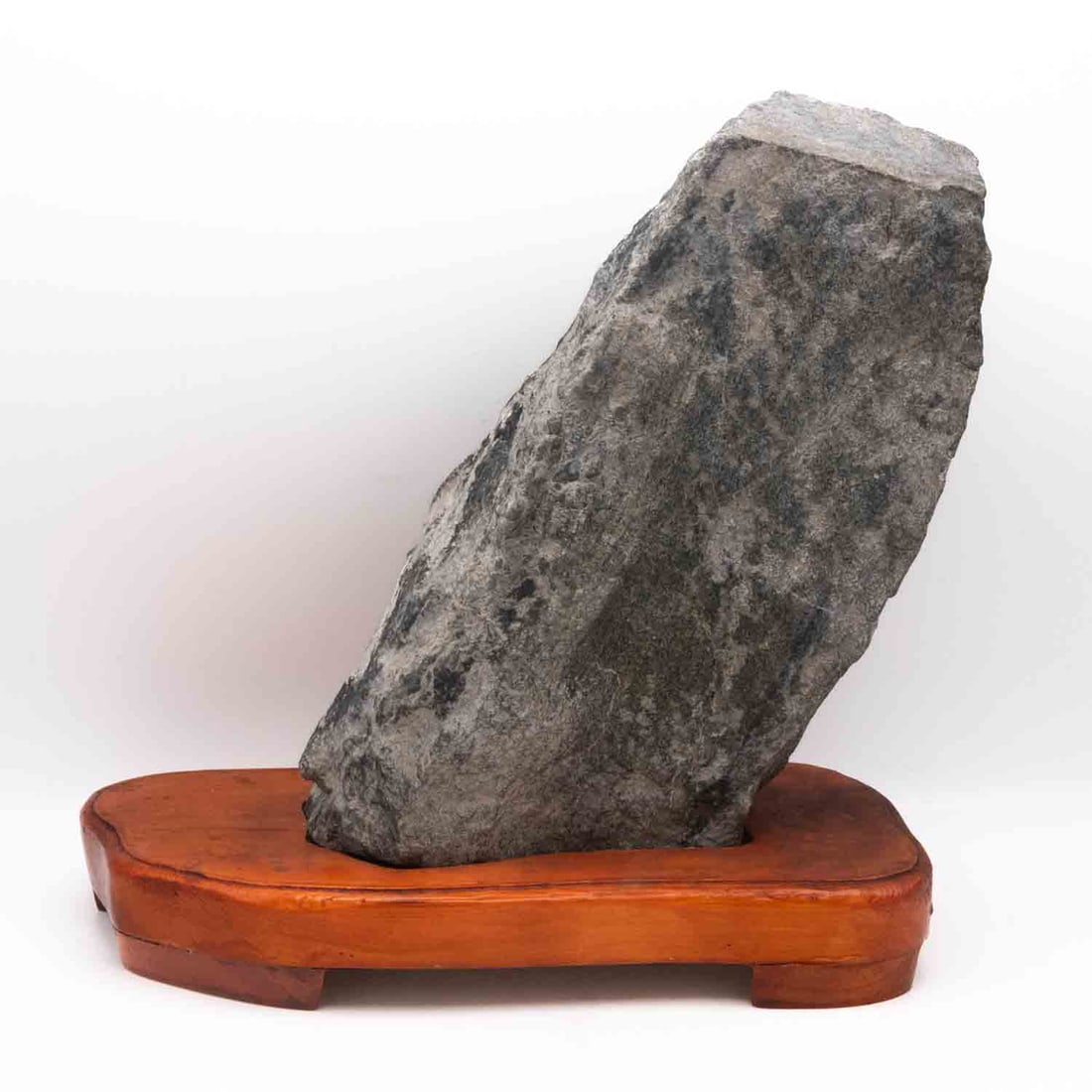 Chinese Scholar's Stone With Display Stand: Medium: Scholar's Stone Size: 10x5x10 inches Age/Detail: Chinese Condition: great overall, check photo for condition reference. A natural stone display specimen presented upright on a fitted wooden st