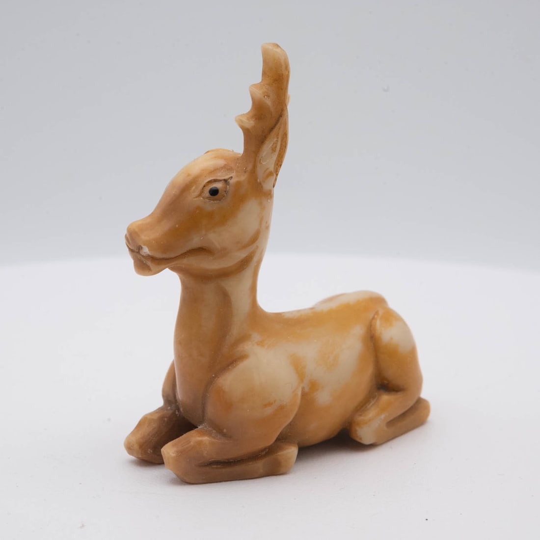 Small Vintage Stone Deer Figure: Medium: Stone Size: 2x2.3x1 inches Age/Detail: Small Vintage Condition: great overall, missing one horn, check photo for condition reference. Provenance: Collection from Estate in Tribecca Please view