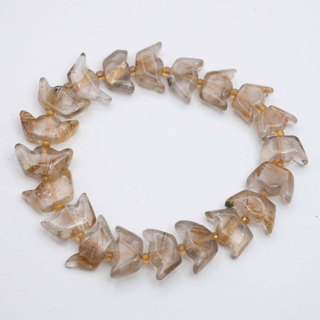 Natural Golden Rutilated Quartz Yuanbao Bracelet: Medium: Golden Rutilated Quartz Size: 12x8mm Age/Detail: Natural Condition: great overall, check photo for condition reference. Provenance: Collection from Estate in Williamsburg LiveShipping is NOT a
