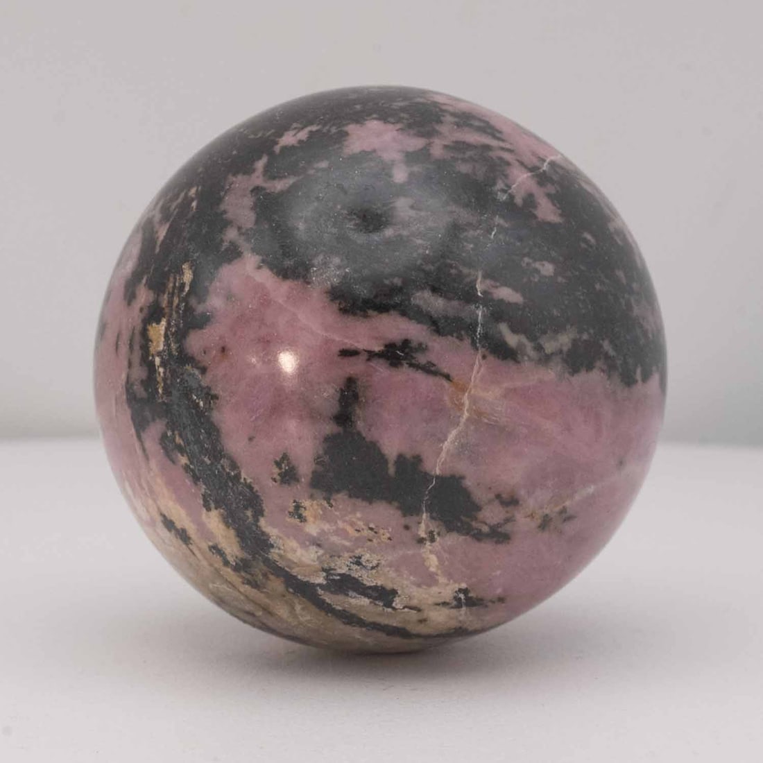 Polished Rhodonite and Black Manganese Sphere Geode