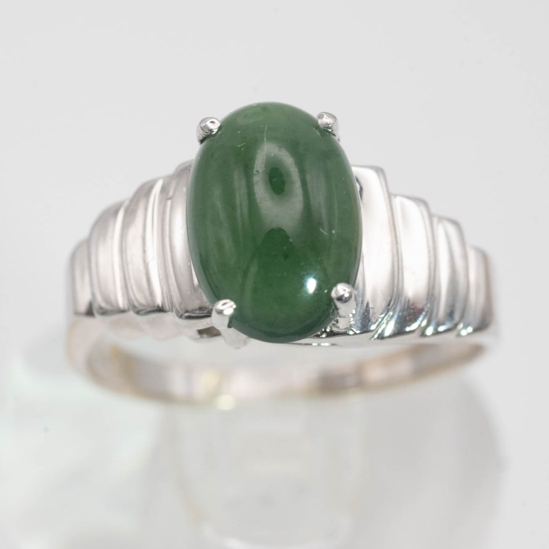 14K White Gold Natural Icy Green Jade Ring: Medium: Natural Icy Green Jade Size: US6.75, 3.25gram Age/Detail: 14K White Gold Condition: great overall, check photo for condition reference. Provenance: Collection from Estate in Williamsburg Pleas