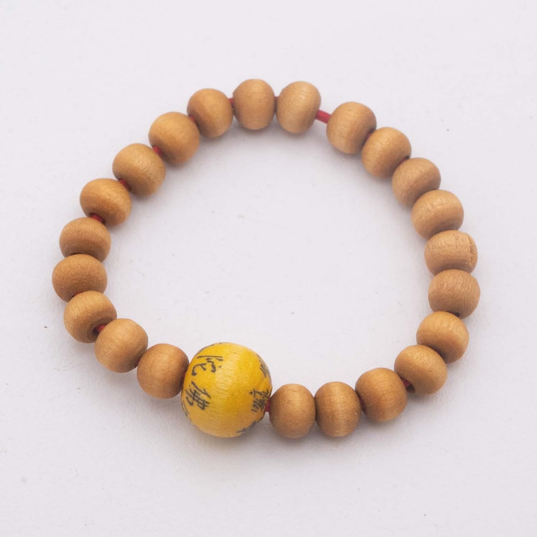 Old Chinese Sandal Wood And Amber Inscribed Prayer Bead Bracelet: Medium: Sandal Wood And Amber Size: 0.5x0.5 inches Age/Detail: Old Chinese Condition: great overall, check photo for condition reference. Light wear to the wood beads and minor rubbing to the inscript