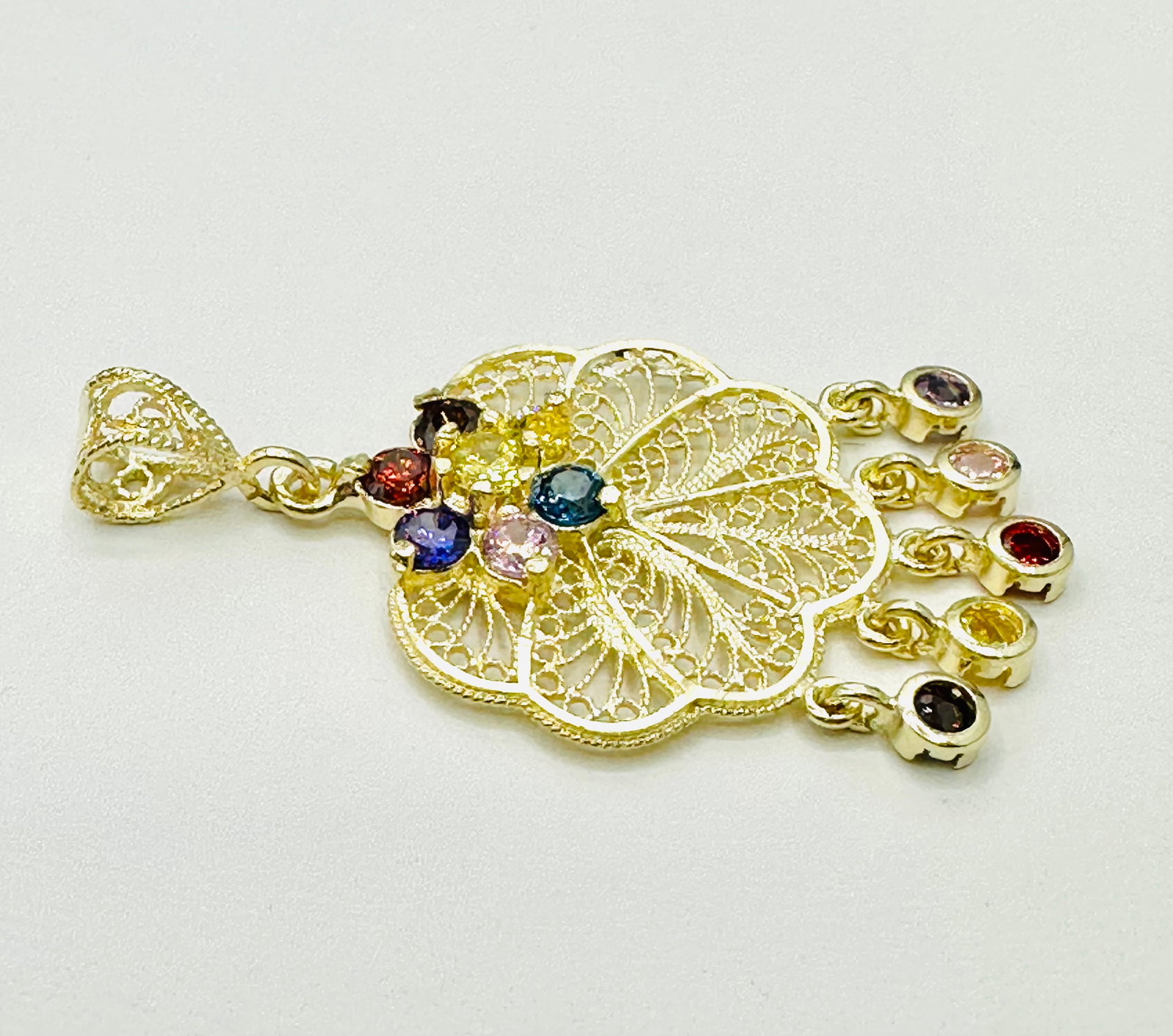 14KT Yellow Gold Pendant with Multi Color Stones # 2434: # 2434 14KT Yellow Gold Pendant with Multi Color Stones 12 pieces stone Pendant Weight: 3.20 grams(t.w.) Pendant Size: 40 mm x 22 mm