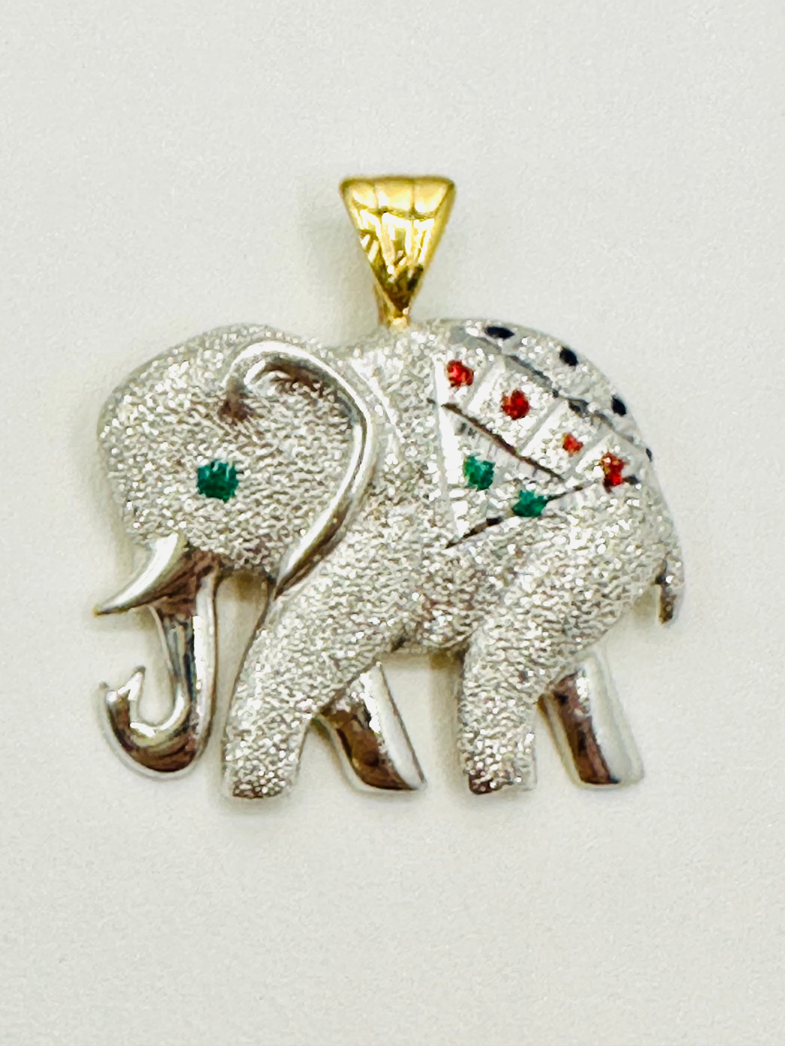 14KT 2- Tone Gold Elephant Pendant # 2435: # 2435 14KT 2- Tone Gold Elephant Pendant Pendant Weight: 4.40 grams(t.w.) Pendant Size: 26 mm x 24.50 mm