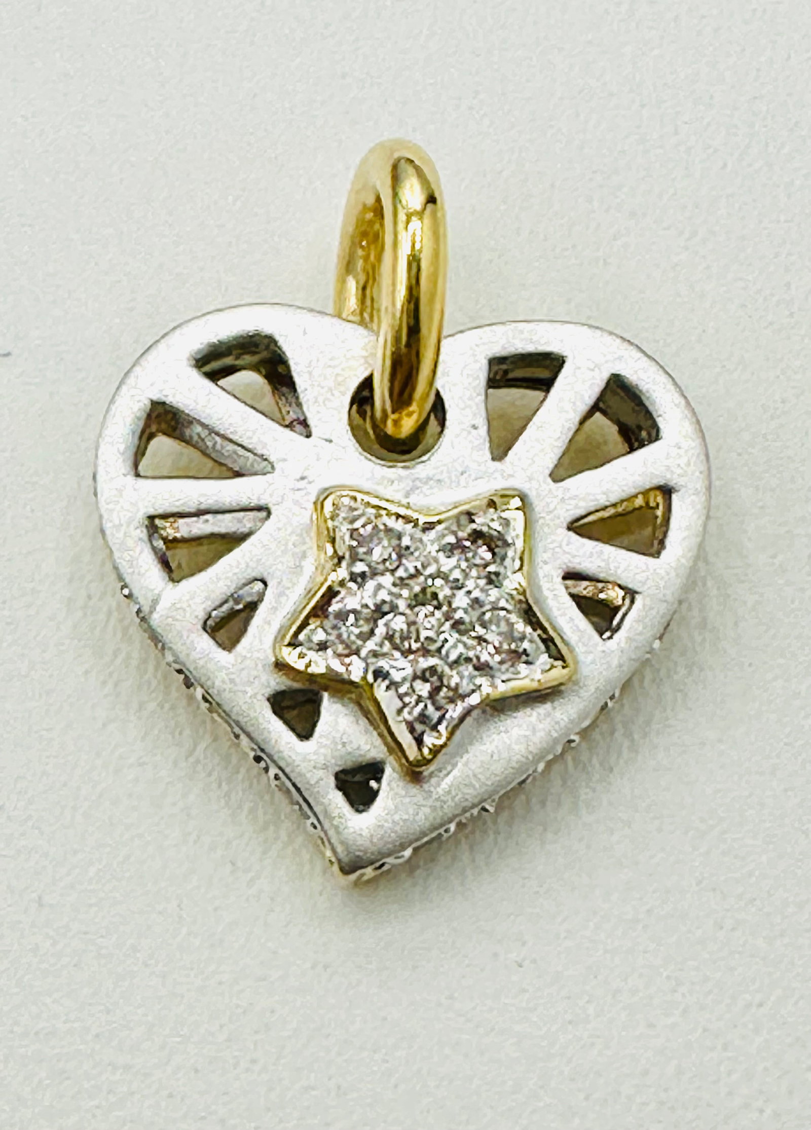 14KT White and Yellow Gold Heart Star Pendant Natural Diamond # 2474: # 2474 14KT White and Yellow Gold Heart Star Pendant Natural Diamond 22 pieces diamond 0.20 carat Pendant Weight: 2.10 grams(t.w.) Pendant Size: 17 mm X 14 mm