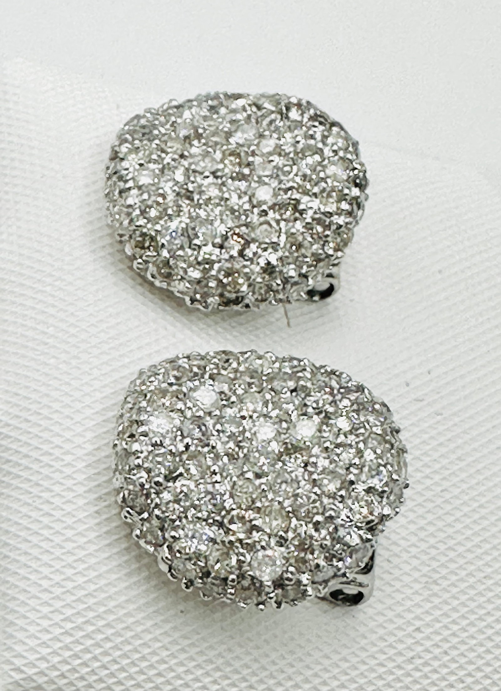 Pair of Natural Diamond Earrings, 18KT White Gold # 2577: # 2577 Pair of Natural Diamond Earrings, 18KT White Gold 188 pieces diamond 2.15 carats (t.w.) Earrings Weight: 4.80grams(t.w.) Omega back closure Earrings Size: 13.5 mm X 13 mm