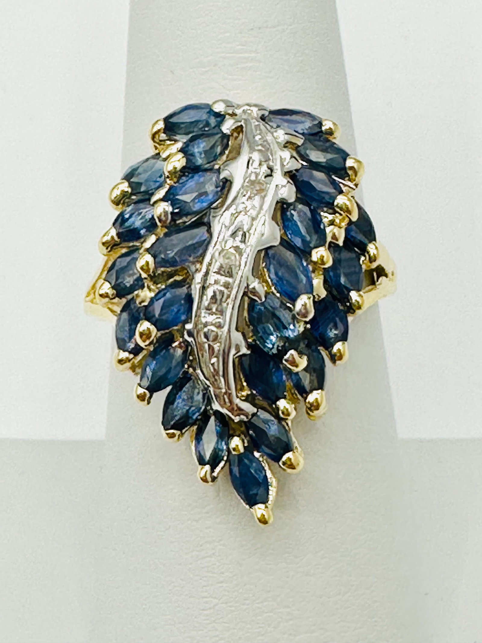 Natural Sapphire and Diamond Ring,14KT Yellow Gold # 2600: # 2600 Natural Sapphire and Diamond Ring,14KT Yellow Gold 2 pieces diamond 0.02 carat(t.w.) 25 pieces marquis sapphire 3.00 carats(t.w.) Ring Weight: 5.60 grams(t.w.) Ring Size: 7.75