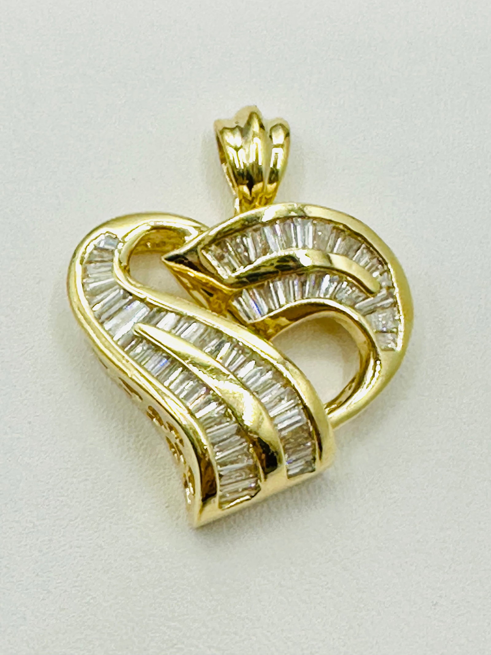 Natural Diamond Heart Pendant, 14KT Yellow Gold # 2625: # 2625 Natural Diamond Heart Pendant, 14KT Yellow Gold Baguette diamond 1.85 carats( t.w.) Pendant Weight: 8.30 grams (t.w.) Pendant Size: 31 mm x 24 mm