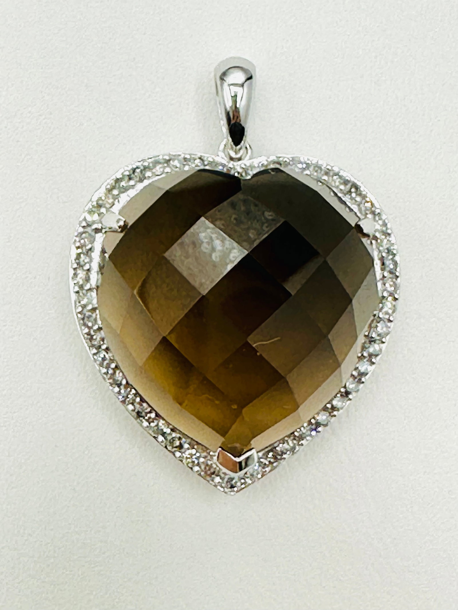 Natural Diamond and Smoky Quartz Heart Pendant, 14KT White Gold # 2634: # 2634 Natural Diamond and Smoky Quartz Heart Pendant, 14KT White Gold 46 pieces diamond 0.70 carats( t.w.) 1 piece heart shaped smoky quartz Pendant Weight: 8.10 grams (t.w.) Pendant Size: 32 mm x 23