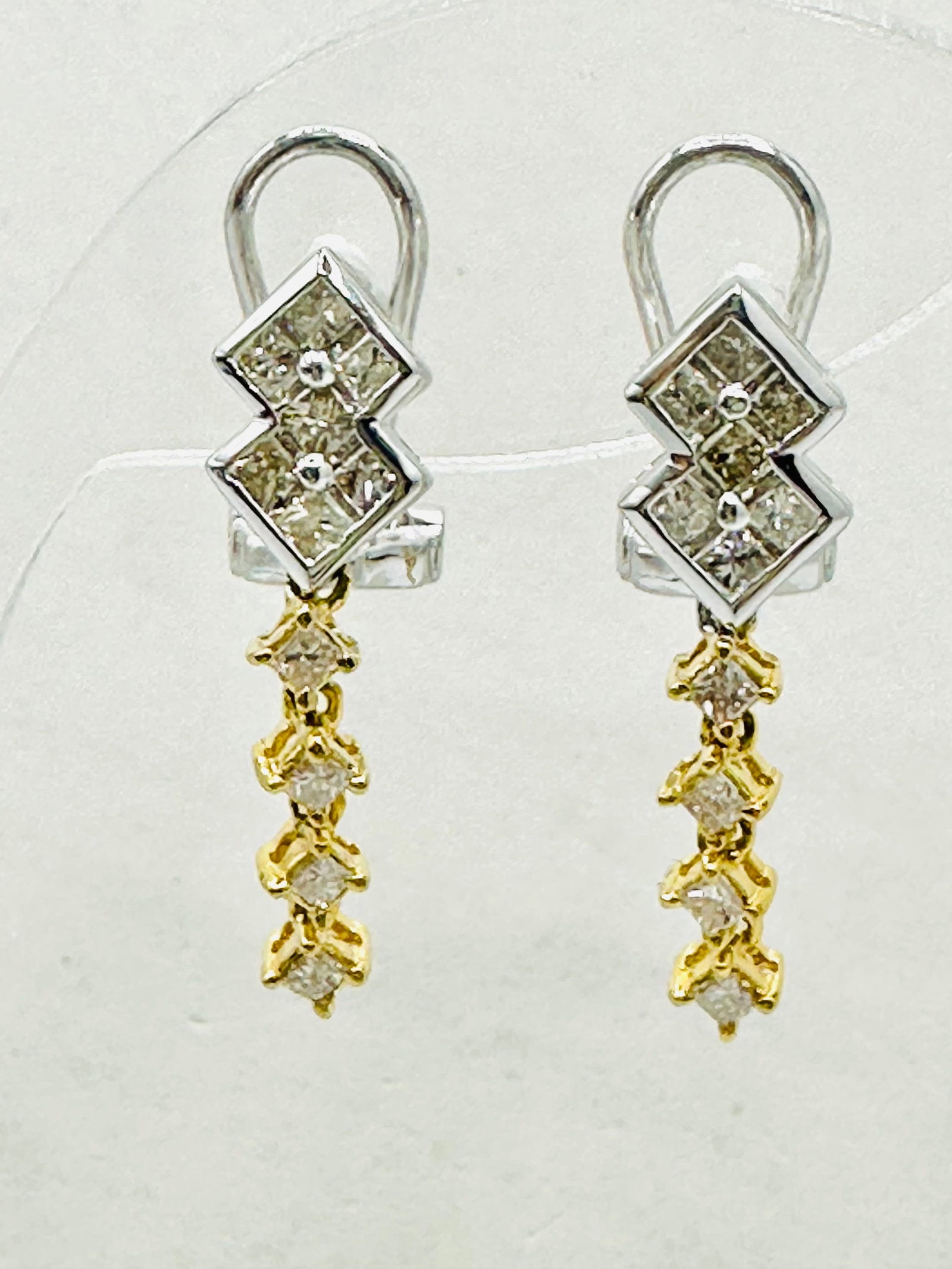 Pair of Natural Diamond Earrings, 18KT White and Yellow Gold # 2635: # 2635 Pair of Natural Diamond Earrings, 18KT White and Yellow Gold 26 pieces princess diamond 0.80 carat(t.w.) Earrings Weight: 3.80 grams(t.w.) Omega back closure Earrings Size: 24 mm X 9 mm