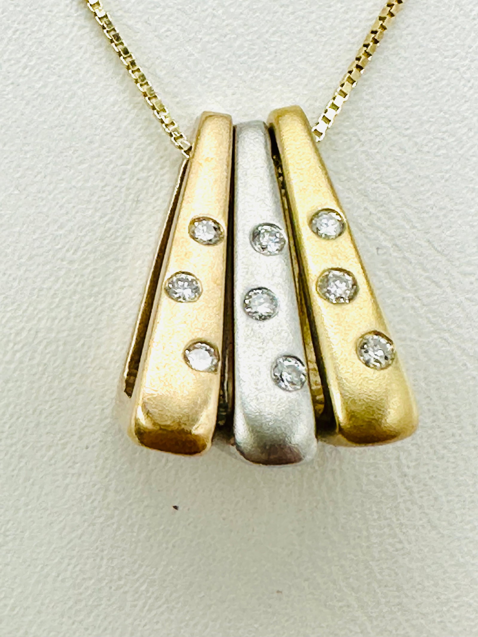 14KT Gold, Natural Diamond Tricolor Charms and Chain # 2652: # 2652 14KT Gold, Natural Diamond Tricolor Charms and Chain 9 pieces diamond 0.10 carat( t.w.) 18â€? box chain with spring ring clasp closure 3 Charm and Chain Weight: 4.30 grams (t.w.) Pendant 
