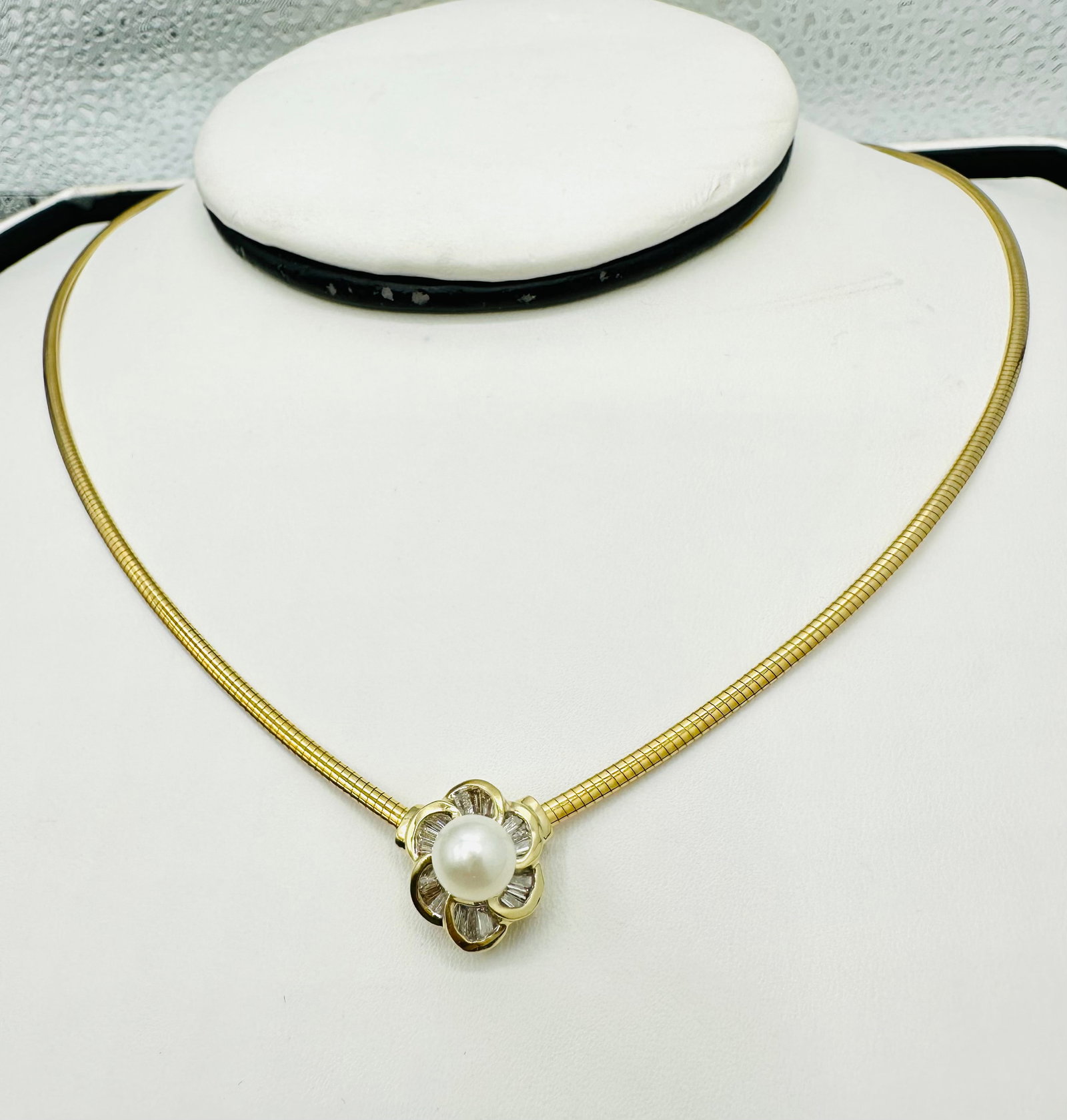 Natural Diamond and Pearl Necklace, 14KT Yellow Gold # 2666: # 2666 Natural Diamond and Pearl Necklace, 14KT Yellow Gold 18 pieces baguette diamond 0.28 carat( t.w.) 1 piece 6.5mm cultural freshwater pearl 17â€? omega necklaces Weight: 9.70 grams (t.w.)