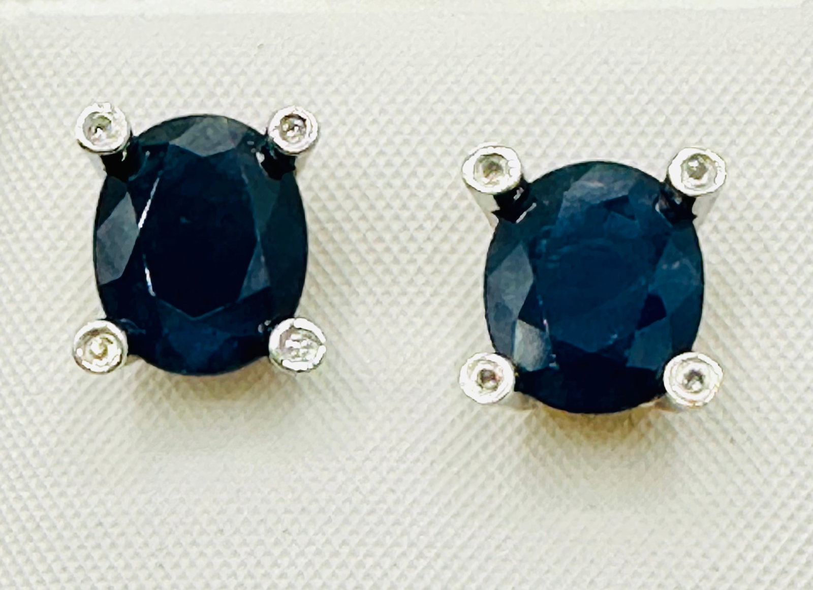 14KT White and Yellow Gold,Pair of Natural Diamond and Sapphire Earrings # 2741: # 2741 14KT White and Yellow Gold,Pair of Natural Diamond and Sapphire Earrings 8 pieces diamond 0.05 carats(t.w.) 2 pieces oval sapphire 5.50 carat(t.w.) Post Black Earrings Weight: 3.50 grams(t.w.) 