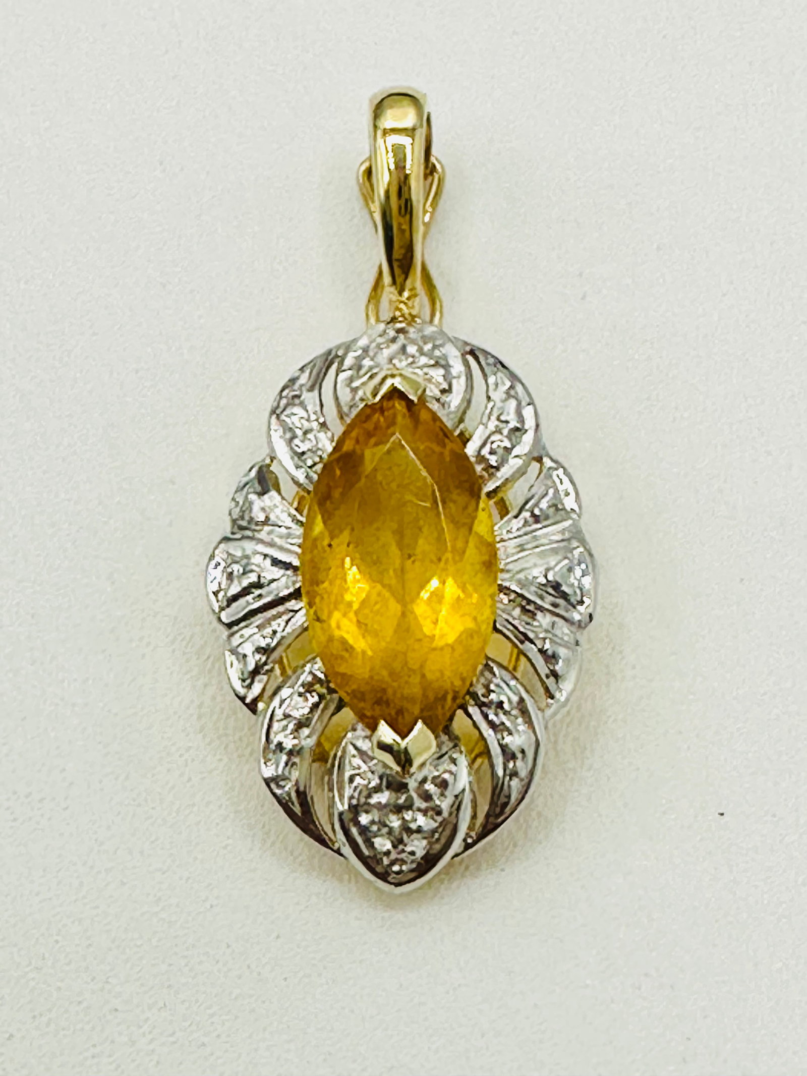 14KT Yellow Gold, Yellow Topaz Pendant # 2756: # 2756 14KT Yellow Gold, Yellow Topaz Pendant 1 piece marquis yellow topaz Pendant Weight: 1.70 grams (t.w.) Pendant size: 27 mm X 12 mm