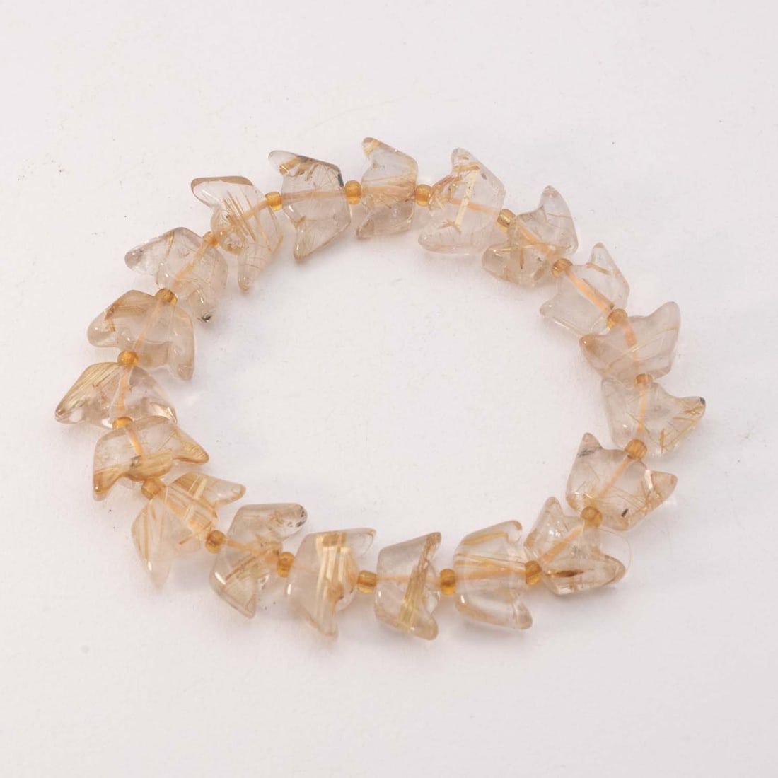 Chinese Golden Rutilated Yuanbao Bead Bracelet: Medium: Golden Rutilated Size: 0.5x0.3 inches Age/Detail: Chinese Condition: great overall, check photo for condition reference. Provenance: Please view all the photos as they are part of the conditio