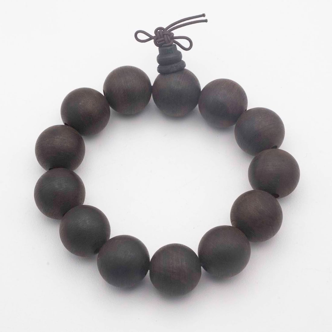 Vintage Chinese Dark Rosewood Bead Bracelet: Medium: Dark Rosewood Size: 0.8x0.8 inches Age/Detail: Vintage Chinese Condition: great overall, check photo for condition reference. Provenance: Collection from Estate in Williamsburg Please view all
