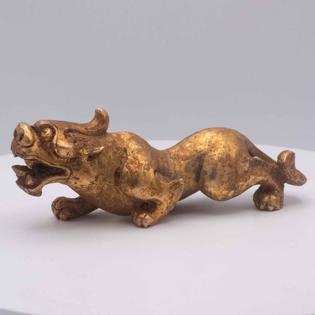 Antique Chinese Gilt Jade Mythical Beast, Bixie Form: Medium: Gilt Jade Size: 4.8x2x1.5 inches Age/Detail: Antique Chinese Condition: great overall, check photo for condition reference. Provenance: Please view all the photos as they are part of the condi