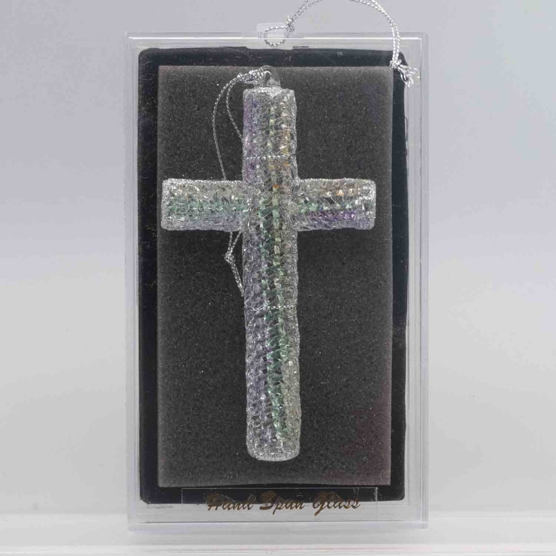 Unique Treasures Hand Spun Glass Cross Ornament In Original Box: Medium: Hand Spun Glass Size: 3.6x6x1.6 inches Age/Detail: Unique Treasures Condition: great overall, check photo for condition reference. Provenance: Collection from Estate in Williamsburg Please vie