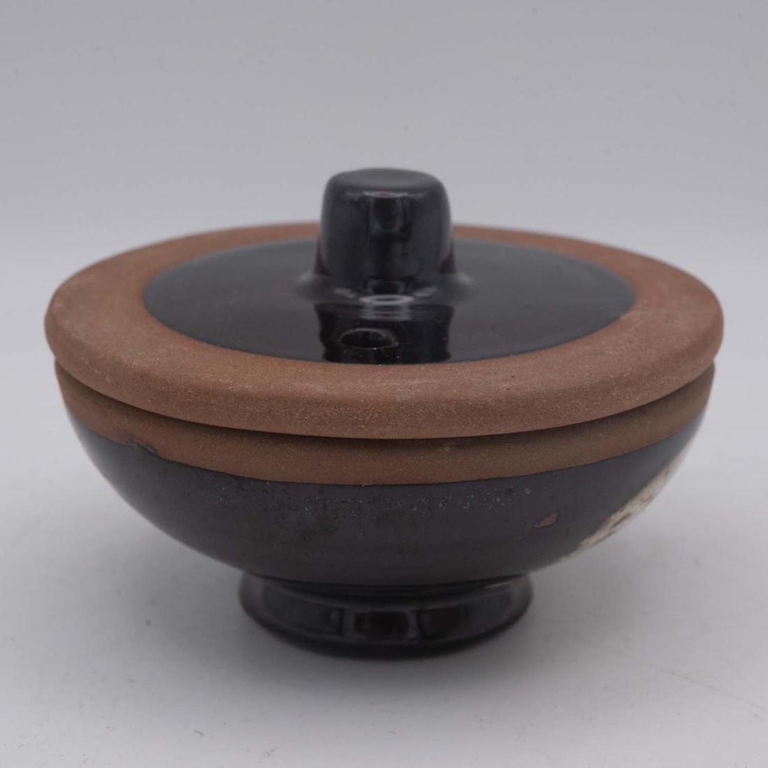 Vintage Japanese Black Glaze Pottery Small Bowl With Lid: Medium: Black Glaze Pottery Size: 2.5x2.5x2 inches Age/Detail: Vintage Japanese Condition: great overall, check photo for condition reference. Provenance: Collection from Estate in Williamsburg Please