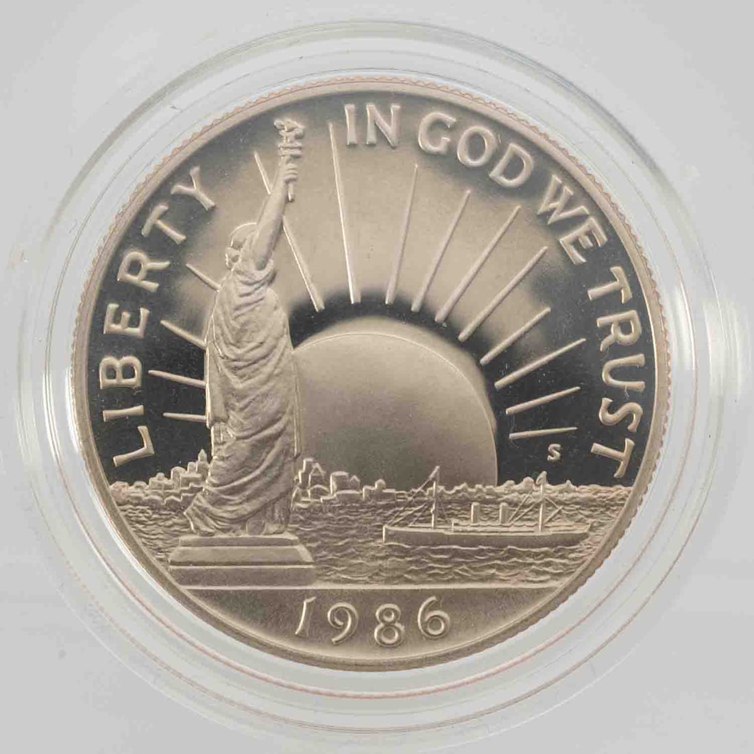 1986 Ellis Island Liberty Half Dollar With Box COA: MLC01416 Provenance: Acquired from reputable coin dealers. Subject: Ellis Island Liberty Half Dollar With Box COA Medium: CLAD Year: 1986 Condition: PF Note: Any condition statement is given as an