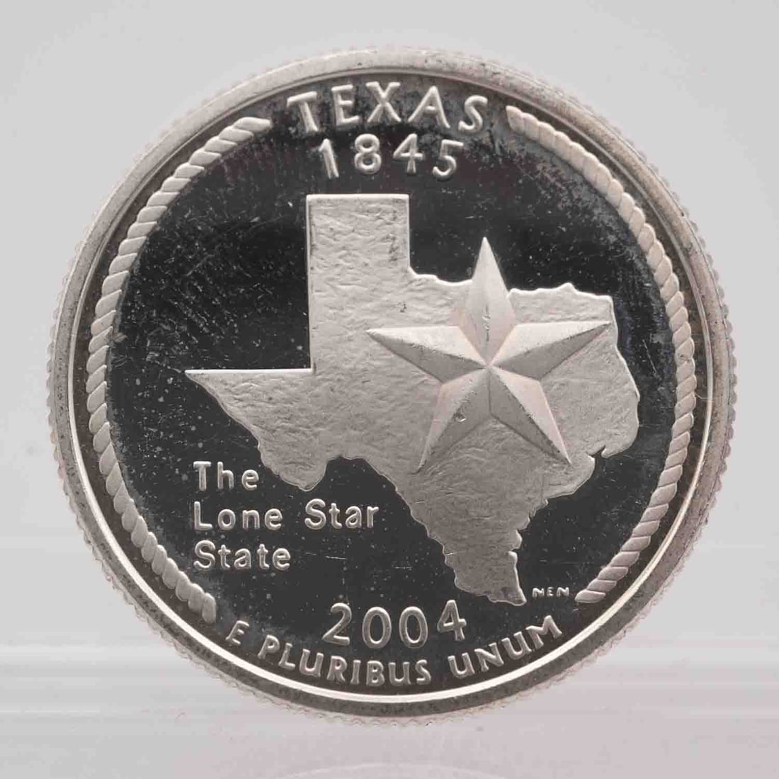 2004 American Proof Silver Quarter Texas: MLC01213 Provenance: Acquired from reputable coin dealers. Subject: American Proof Silver Quarter Texas Medium: 900 Silver Year: 2004 Condition: AU Note: Any condition statement is given as an opinion